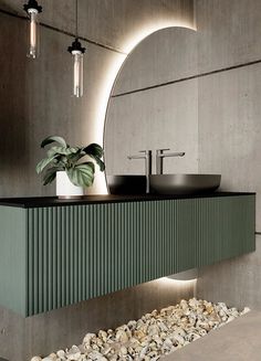 a bathroom with two sinks and a large mirror above the sink, along with pebbles on the floor