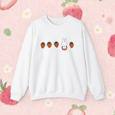 You WILL get stopped in the street and asked where you got this crewneck. Trust me it has happened multiple times haha. Miffy and strawberries = cuteness overload.  Ideal for any occasion, this unisex heavy blend crewneck sweatshirt is pure comfort. These garments are made from polyester and cotton. This combination helps designs come out looking fresh and clean. The collar is ribbed knit, so it retains its shape even after washing. There are no itchy side seams on these sweaters.  Materials/Mor Casual Hoodie With Cartoon Print And Crew Neck, Cute Sweatshirt With Funny Print And Crew Neck, Cute Crew Neck Sweatshirt With Funny Print, White Cartoon Print Crew Neck Sweatshirt, White Crew Neck Sweatshirt With Cartoon Print, Casual Crew Neck Sweatshirt With Cartoon Print, Cute Crew Neck Hoodie For Streetwear, Cute White Crew Neck Hoodie, Cute White Crew Neck Sweatshirt