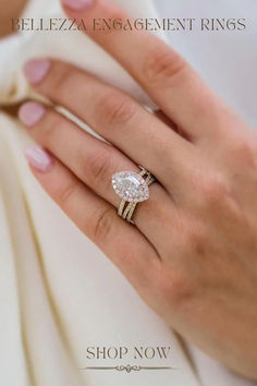 a woman's hand with a ring on it and the words, belezza engagement rings shop now