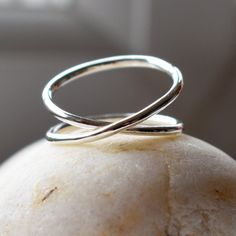 A beautiful, sculptural, handmade infinity ring in 100% Recycled Sterling Silver. Made from 925 Sterling Silver, the band wraps effortlessly around the finger, forming a continuous Infinity symbol. I make this ring from one length of 1.5mm wide sterling silver. This gives the ring an elegant, flowing, sophisticated look. Once formed, soldered and finished up, I tumble the ring to give it strength and durability, then hand polish to a beautiful shine. Each ring is custom handmade for you when you Handmade Minimalist Infinity Rings, Minimalist Handmade Infinity Rings, Infinity Ring, Infinity Symbol, Silver Gifts, Recycled Sterling Silver, Ring Handmade, Handmade Ring, Recycling