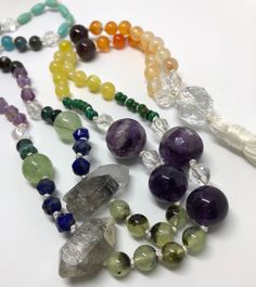 Is it a chakra mala? Is it a pride mala? Is it just a bunch of pretty gems from mama nature? You decide. This mala necklace has all the colors of the rainbow and balancing energy for the whole chakra system. It absolutely has 108 beads, so you could use for meditation, but it's important to note that they're all different shapes and sizes, so that may or may not be a concern for you. Also, there's a section of tiny little turquoise guys that are in pairs, so it would take a little extra concentr Rainbow Gemstone Beaded Necklaces For Healing, Spiritual Mala With Polished Beads For Healing, Bohemian Rainbow Crystal Necklaces For Healing, Spiritual Healing Mala With Polished Beads, Multicolor Spiritual Crystals For Gift, Multicolor Spiritual Crystals Gift, Multicolor Spiritual Crystals As A Gift, Spiritual Multicolor Crystals As Gift, Spiritual Round Beads Crystals For Jewelry Making