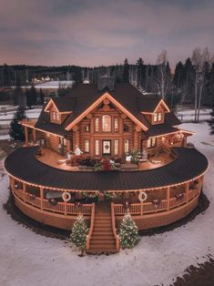 a large wooden house with christmas lights on it