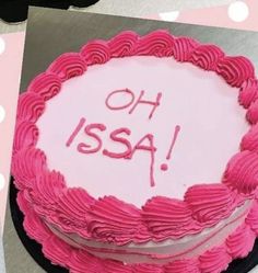 a cake with pink frosting that says oh usa on it and the word'ssa'written in red icing