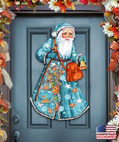 an image of santa claus on the front door with decorations around him and holding a bell