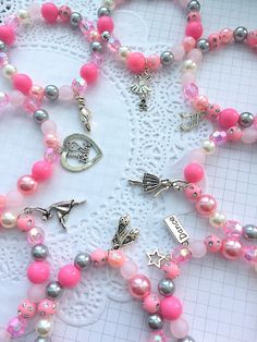 "Sampler pack of EIGHT, Ballet party, Ballerina party, ballerina bracelet, ballerina jewelry, recital, ballet bracelet, ballet party favor. Party planning is already so stressful. Leave the favors up to us! This listing is for (8) child sized bracelets. DETAILS and MEASUREMENTS: Beads vary in sizes from 6mm-10mm. The length of a bracelet is 6.5\" (we can make them smaller or bigger for you). COLOUR & CHARM CHOICES: If the bracelet does not match your party theme exactly, just send us a note. We Pink Adjustable Charm Bracelet For Parties, Adjustable Pink Charm Bracelet For Party, Pink Handmade Stretch Bracelet For Party, Handmade Pink Stretch Bracelet For Party, Whimsical Adjustable Beaded Bracelets For Party, Pink Beaded Bracelets For Gift, Pink Flexible Beaded Bracelets For Gifts, Playful Pink Bracelets For Party, Pink Playful Stretch Bracelet For Party