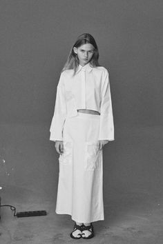 Crafted from a tough white cotton, this mid-rise skirt is complemented by a wooden black criss cross buttons on the back and two precise pleats and features big handmade pockets in front.Pair with the collection's Nizhyn White Ceramic Buttons Cropped shirt and play with proportions.Composition 100% pure cottonButtons: 100% woodDry clean onlyHandmade by women for womenSizes S (European 36)Bust: fits bust around 85 -89 cmWaist: fits waist around 68- 73 cmHips: fits hips around 92-95 cmFor overall Relaxed Cotton Skirt With Patch Pockets, Chic Skirt With Patch Pockets For Spring, Cotton Skirt With Pockets For Daywear, Chic Cotton Skirt With Side Pockets, Chic Cotton Cargo Skirt With Side Pockets, White Cotton Mini Cargo Skirt, White Fitted Cotton Cargo Skirt, Fitted White Cotton Cargo Skirt, White Mini Cargo Skirt For Spring