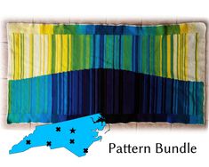 a blue and yellow striped quilt with the state of new hampshire in it's center