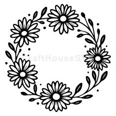 a black and white drawing of a wreath with daisies