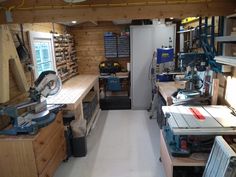 a room filled with lots of work tools and woodworking equipment on top of wooden shelves