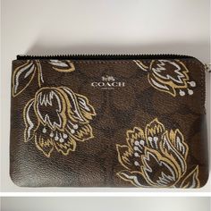 Coach Wristlet Corner Zip Colors:Brown/Gold Metallic Gold Flowers Print Non Smoking Home . New With Tags. Brown Wristlet With Zipper Pouch As Gift, Brown Pouch Wristlet As Gift, Brown Wristlet With Removable Pouch As Gift, Brown Wristlet With Zipper Pouch For Gift, Elegant Brown Wristlet With Zipper Pouch, Coach Brown Coin Purse For Everyday, Coach Brown Clutch With Removable Pouch, Elegant Brown Coach Coin Purse, Brown Coach Wristlet For Formal Occasions