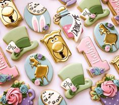 decorated cookies are arranged in the shape of animals and numbers for first birthdays or baby showers