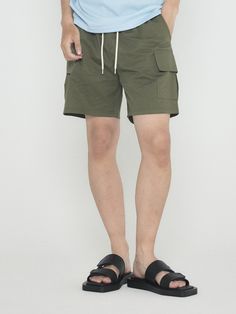 Editor's NoteANALOGMOOD's Cotton Cargo Short Pants has a standard regular fit that is comfortable and easy to wear. It is made out of bio-washed cotton fabric that has a soft texture achieved through removal of short fibers, and does not form lint easily. It has large cargo pockets on the side, but still gives clean and refined look that can be styled with various items during the summer season. - Cargo pockets on the side- Bio washed fabric- Adjustable waistband with stringsMeasurements (in.)M/L- Length: 16.54 in / 17.32 in- Waist: 12.60 in - 15.35 in / 12.99 in - 16.14 in- Thigh: 12.60 in / 13.78 in- Crotch: 11.81 in / 12.60 in- Hem: 11.42 in / 12.20 in* Model info: Height - 6', Waist - 32, Wearing size LComposition & Care- Cotton 100%- Refer to care labelDesigner- by ANALOGMOOD Military Style Cotton Bottoms With Elastic Waistband, Military Cotton Bottoms With Cargo Pockets, Military Style Cotton Cargo Pants With Elastic Waistband, Military Cotton Cargo Pants With Elastic Waistband, Khaki Cotton Cargo Bottoms, Cotton Relaxed Fit Cargo Pants With Side Pockets, Cotton Cargo Bottoms For Outdoor, Military Style Cotton Cargo Shorts With Patch Pockets, Military Cotton Cargo Bottoms