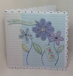 a handmade birthday card with flowers on it