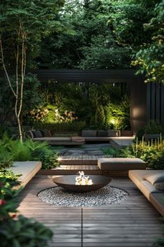 an outdoor patio with fire pit surrounded by greenery