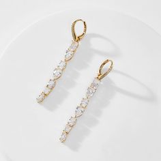 ABOUT THE PRODUCTShine bright with these elegant long linear earrings featuring mixed CZ stones for ultimate sparkle. Metal: Brass Plating: 18KT Gold or Rhodium Stones: Cubic Zirconia Length: 2 1/8 in Width: 1/4 in Luxury Long Drop Cubic Zirconia Linear Earrings, Crystal Long Drop Linear Earrings, Luxury Cubic Zirconia Dangle Earrings, Long Drop Linear Earrings With Diamond Accents, Cubic Zirconia Drop Linear Earrings For Evening, Modern Cubic Zirconia Linear Earrings For Wedding, Long Drop Cubic Zirconia Linear Earrings, Long Drop Linear Earrings With Cubic Zirconia, Cubic Zirconia Long Drop Linear Earrings