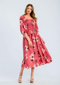 Easy floral midi dress featured in a flowy silhouette with a smocked bodice and volume sleeves. Cotton voile, textured fabrication  Relaxed fit  Side pockets -Contents 70%Cotton 30%Rayon Approximate measurements are as follows Small: Length:48 3/4 " Bust: 29"- 49"  Waist: 28- 48" Medium: Length:49 1/4" Bust:31"-51"    Waist 30- 50"  Large: Length:49 3/4" Bust:33"-53" Waist 32 -52" Bohemian Ruched Maxi Dress For Garden Party, Square Neck Floral Dress For Day Out, Feminine Floral Dress With Smocked Bodice, Spring Maxi Dress With Smocked Bodice, Pink Smocked Maxi Dress For Spring, Pink Maxi Length Smocked Dress For Spring, Spring Feminine Smocked Dress With Ditsy Floral Print, Spring Flowy Ruched Maxi Dress, Flowy Ruched Maxi Dress For Spring