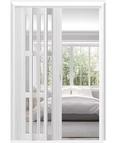 an open door leading to a bedroom with a bed in the corner and trees outside