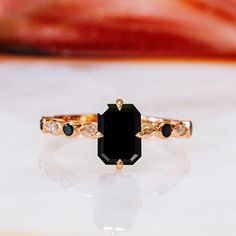 Black Emerald Wedding Set, Black Diamond Ring, Black Wedding Band, Black White Ring Set, Black Emerald Ring, Multi stone Black Bridal Set 🖤Setting Total Carat Weight: 3.3 Carats 14K Rose Gold Certificate Of Authenticity Included 🖤Main Diamond: Shape: Emerald Cut Weight: 1.5 Carats Color: Fancy Black Clarity: Opaque Color Origin: Enhanced Color Distribution: Even Grade: AAA Measurements:  mm Stock ID: 🖤Accent Diamonds  Shape: Round & Marquise Weight: Black & White Carats Color: Black Clarity: Opaque Color Origin: Enhanced Color Distribution: Even Grade: AAA Stock ID: Notes: 🖤All diamonds are natural, earth-mined diamonds that were suitable for Color Enhancement into Fancy Black color. 🖤Black diamonds are known to be difficult to cut and polish because Of their structural patterns, Some Formal Black Rings With Accent Stones, Black Diamond Rings With Accent Stones, Formal Black Jewelry With Prong Setting, Elegant Black Diamond Rings, Elegant Black Spinel Jewelry For Wedding, Black Jewelry With Center Stone For Anniversary, Black Jewelry With Prong Setting For Anniversary, Formal Black Diamond Jewelry, Black Diamond Jewelry With Prong Setting