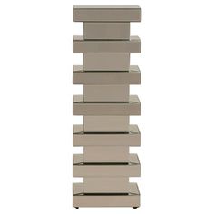 a tall stack of boxes sitting on top of each other in front of a white background