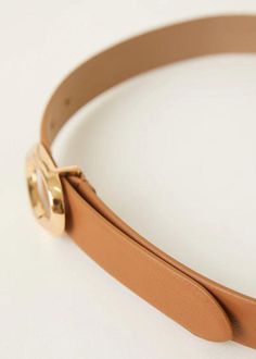 Introducing the Gracie Belt in Tan Gold. Crafted in Italy from smooth Italian leather, this belt exudes timeless style. Its versatility makes it a must-have accessory for any season. Hip Belt Adjustment: 5 holes Strap Width: 1'' Genuine Italian Leather with Nubuck Lining Made in Italy Sizing: X-Small: 31'' Small: 33'' Medium: 35'' Large: 37'' Measurements taken from buckle point to center hole. If you would like to see more photos or speak with one of our stylists with any further questions rega Hip Belt, Woven Belt, Italian Leather, Timeless Style, Solid Black, Online Boutique, Timeless Fashion, Buckle, Italy