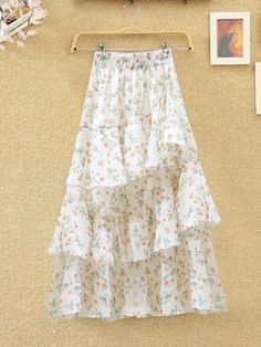 Material: PolyesterStyle: CasualOrigin: CN(Origin)Fabric Type: BlendedWaistline: Natural FactorsPattern Type: PrintSilhouette: Ball GownDresses Length: Mid-CalfDecoration: NONEGender: WOMENpattern: FloralSource type: SpotSkirt type: Irregular skirtsize: S M L XL 2XLstyle: Fresh and sweetSkirt length: Middle-skirtFabric: ChiffonSuitable age: 18-45 years oldSkirt category: skirt Spring Skirt With Layered Long Hem, Spring Long Skirt With Layered Hem, White Ruffled Maxi Skirt For Brunch, Spring White Asymmetrical Skirt, White Chiffon Skirt For Spring, White Tiered Skirt For Spring, White Asymmetrical Skirt For Spring, White Tiered Maxi Skirt For Brunch, White Asymmetrical Skirt For Brunch