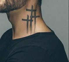 a man with a cross tattoo on his neck