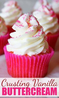 vanilla buttercream cupcakes with white frosting and sprinkles