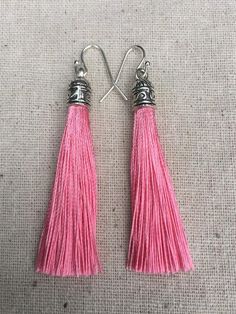 Chic pink tassel earrings!  They would add a pop of color to any outfit for any occasion.  Dress them up or down.  They are timeless and versatile.  They are lightweight, fun and unique!The tassels measure 2 1/8” long by 1/4” wide.  They hang from simple silver ear wire hooks.  Overall drop length is about 2 1/4”.  Metal is allergy free plated silver.These are my latest creation!  I have them available in many colors!  Find them all under the category tassel earrings in my shop.Thanks for stoppi Pink Tassel Earrings With Latkans, Pink Tassel Drop Earrings, Pink Dangle Tassel Earrings With Fringe, Adjustable Pink Tassel Drop Earrings, Pink Fringe Tassel Dangle Earrings, Pink Tassel Earrings As Gift, Pink Tassel Earrings For Gift, Pink Dangle Tassel Earrings For Gifts, Pink Tassel Earrings For Summer Gifts