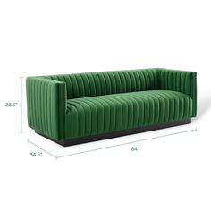 an image of a green couch with measurements