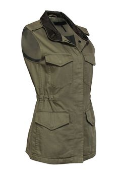 Give a salute to great style with this luxe layer from Rag & Bone! This classic vest is given a military-inspired makeover with a warm olive hue and utility-style pockets. Perfect for bringing some rebellious vibes to your chilly weather wardrobe. Go edgy for the pumpkin patch and beyond when you pair this bad boy with distressed jeans and combat boots. Size XS Shell: 100% Cotton Trim: 100% Cupro Lining: 51% Cupro, 49% Cotton Front button-up closure Lined upper back High neckline w/ satin lining Utility Vest With Cargo Pockets For Work, Sleeveless Military Outerwear In Khaki, Military Vest With Multiple Pockets For Winter, Military Style Khaki Vest For Winter, Military Style Winter Workwear Vest, Winter Military Work Vest, Khaki Military Vest With Pockets, Fitted Khaki Vest For Work, Khaki Utility Vest For Workwear