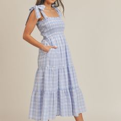 Tiered Blue Plaid Midi Dress With Lace Trim Size S M L This Dress Is A Plaid Midi Dress With Details Of A Square Neckline, Wide Adjustable Tying Straps And Lace Trim Detail. It Has Pockets, Is Fully Lined And Has A Smocked Bodice With Ruffle. 100% Polyester Imported Blue Midi Dress With Tie Straps For Day Out, Blue Midi Dress With Tie Straps For Vacation, Blue Midi Dress With Tie Straps, Blue Sundress With Tie Straps For Brunch, Casual Blue Midi Dress With Tie Straps, Blue Casual Midi Dress With Tie Straps, Spring Blue Midi Dress With Tie Straps, Blue Midi Dress With Tie Straps For Spring, Fitted Blue Midi Dress With Tie Straps