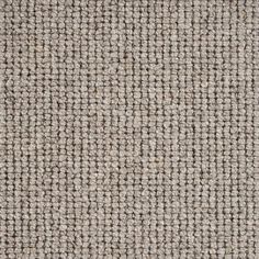 an upholstered gray and white fabric textured with coarsed lines, closeup