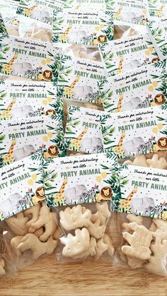 several bags of party animals on a wooden table