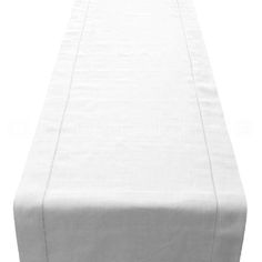 an empty white table cloth on top of a wooden table