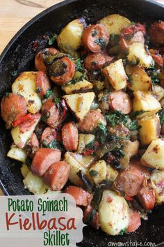 potato and spinach kielbasa skillet in a cast iron skillet