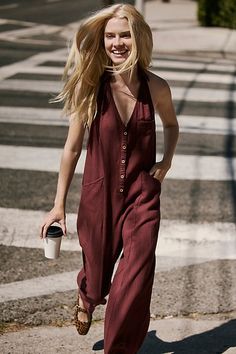 A true throw-on-and-go staple from free-est, this easy jumpsuit is the definition of a seasonless style. **Fit:** Relaxed, shapeless fit throughout with wide-leg design **Features:** Plunge halter neckline, low back, dropped armholes, front button-up closures, side pockets **Why We ❤ It:** Easy with sneakers or elevated with bold platforms, this style has endless ways to wear. | Harper Jumpsuit by free-est at Free People in Red, Size: L Red Relaxed Fit Jumpsuits And Rompers For Summer, Red Relaxed Fit Jumpsuit For Summer, Halter Neckline, Small Bust, Low Back, Free Clothes, Boho Outfits, Wardrobe Staples, Knitwear