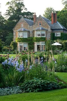 a large house surrounded by lush green grass