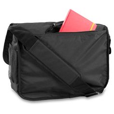 a black messenger bag with a red book in the pocket and a pink notebook sticking out of it