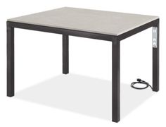 an outdoor table with a power cord attached to the top and one end on the ground