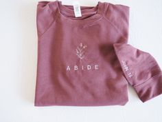 PLEASE READ ALL  Clothe yourself in TRUTH! PLEASE READ ALL** "Abide in Me, and I in you. As the branch cannot bear fruit of itself, unless it abides in the vine, neither can you, unless you abide in Me." John 15 . This lightweight crewneck is embroidered on the front and on the left sleeve with "John 15" Color pictured: IVORY Thread color is black- all other crewneck options that are colors will be white thread unless discussed otherwise This powerful christian crewneck sweatshirt design speak v Fall Gift Sweatshirt With Embroidered Logo, Fall Custom Embroidery Sweatshirt Gift, Custom Embroidery Sweatshirt As Fall Gift, Crewneck Sweatshirt Design, Abide In Me, Abide In Christ, Christian Crewneck, Bible Verses For Women, Taupe Colour