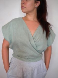 "Women`s linen shirt, wrap layering top, sleeveless linen blouse, V neck plus size oversized crop top. Beautiful and very comfy wrap linen top, so feminine, simple, stylish and super versatile. This top has v neck with a double layered front and comfortable elegant look. Belt straps can be tied in the front, back or on the side. It is made of quality pure linen. You can choose another color from the last picture. Size chart: SIZE XS(US 0-2, UK 6-8, Italian 36-38, French 32-34) bust: fits bust around 32.5\"-33.5\"/81-85cm Waist: fits waist around 25\"-26\"/63.5-66cm Hips: fits hips around 35\"-36\"/89-91cm SIZE S(US 4-6, German 34-36, UK 10-12, Italian 40-42, French 36-38) bust: fits bust around 34.5\"-35.5\"/87-90cm Waist: fits waist around 27\"-28\"/68.9-71cm Hips: fits hips around 37\"-3 Cotton Wrap Top For Summer, Summer Cotton V-neck Wrap Top, Versatile Summer V-neck Wrap Top, Casual Linen Wrap Top, Casual Linen Wrap Top For Summer, Versatile Summer Wrap Top, Chic Cotton Wrap Top For Summer, Versatile Wrap Tops For Summer, Summer Wrap Cotton Tops