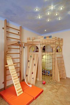 there is a climbing wall and ladder in the children's room