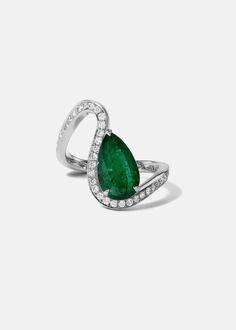 - The Trace Collection The Emerald Diamond Trace Pavé Ring is crafted of polished 18 karat gold, showcasing a fluid line of diamonds that delicately dances around the finger with a nestled 1.6ct pear cut emerald. 1.6ct emerald | approx 0.45tcw diamonds Custom variations can be made with alternative stone sizes. For inquiries: bespoke@katkimfinejewelry.com Available in Yellow Gold, White Gold — Platinum upon request. Please note: All our pieces are made to order and requires 2-4 weeks for product Formal Pear-shaped Brilliant Cut Emerald Ring, Luxury Pear-shaped Diamond Ring With Pavé Setting, Luxury Pear-shaped Rings With Pave Setting, Elegant Emerald Diamond Pear-shaped Ring, Elegant Pear-shaped Emerald Diamond Ring, Formal Pear-shaped Emerald Ring With Diamond, Elegant Pear Shaped Gemstone Rings, Luxury Platinum Teardrop Diamond Ring, Fine Jewelry Platinum Pear-shaped Ring