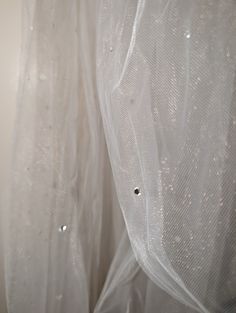 the curtains are covered with water droplets