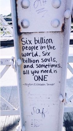 graffiti on the side of a parking meter reads six billion people in the world, six billion souls and sometimes all you need is one