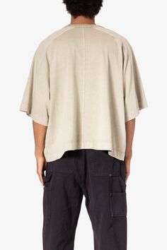 the Paneled Hidden Pocket Tee features a flat hem line and an extended shoulder seam for a relaxed, dropped shoulder fit, constructed from a washed cotton fabric, panel across the chest with an integrated pocket, and finished with an exaggerated oversized fit. details oversized fit 100% cotton model is 6’1, 140 lbs and wears a size medium Boxy Fit Washed Cotton Top, Boxy Fit Cotton Washed Top, Oversized Relaxed Top For Casual Gatherings, Relaxed Oversized Top For Casual Gatherings, Relaxed Washed Cotton Tops, Casual Cotton Tops With Curved Hem, Baggy Cotton Crew Neck Top, Baggy Crew Neck Cotton Top, Summer Boxy Fit Washed Tops