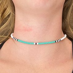 The Tri-Color beaded choker is a fun combination of turquoise, black and white. The pattern creates a look that is perfect for a day relaxing at home or a night out on the town. All chokers are customizable to the size you need so please be sure to measure your neck where you want your choker to sit and order accordingly! This high quality beaded choker is beautiful worn on its own or layered. It is secured with a sterling silver lobster claw and made with glass beads that can stand the test of Summer Beach Choker With Round Beads, Turquoise Choker With Round Beads For Summer, Beaded Choker Necklaces For The Beach, Beaded Choker Necklace For The Beach, Turquoise Beaded Choker For The Beach, Summer Turquoise Choker With Colorful Beads, Beaded Choker For Beach, Turquoise Beaded Choker For Beach, Turquoise Tiny Beads Choker For Beach