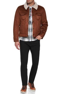 Be cozy, warm and classically cool in this trucker jacket featuring a solid wash and plush faux-shearling lining. 25 1/2" length (size Medium) Front snap closure Spread collar Button cuffs Chest button-flap patch pockets; front welt pockets Lined, with synthetic fill 99% polyester, 1% spandex with 100% polyester faux-shearling trim Machine wash, tumble dry Imported Men's Clothing Fall Denim Jacket With Flap Pockets, Levi's Casual Leather Jacket For Fall, Classic Brown Denim Jacket For Winter, Levis Sherpa Jacket Outfit Men, Levis Fur Lined Jacket, Corduroy Trucker Jacket, Levis Wool Trucker Jacket, Rugged Brown Shearling Outerwear, Brown Single-breasted Corduroy Outerwear