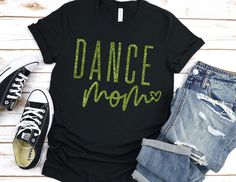 Dance Mom, Dance Team Mom, Dance Competition Shirt, Dance Mama, Dance Team Mom Gift, Unisex Fit Shirt, Custom Colors, Glitter Shirt, Dance Bella Unisex Fit Shirts will be used as stock allows. Dance Mom Shirt Ideas, Team Mom Shirt, Mama Tee Shirts, Dance Mom Shirt, Team Mom Gifts, Dance Mom Shirts, Glitter Tee, Competition Dance, Glitter Shirt