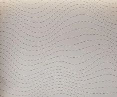 a white wall with wavy lines on it